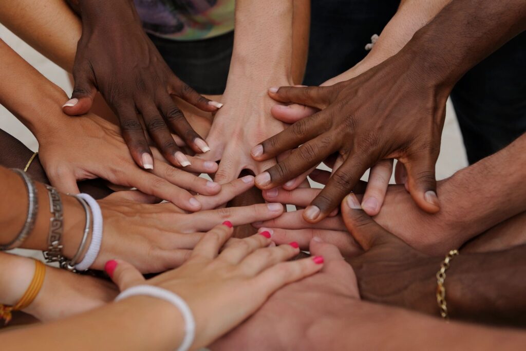 multi-colored hands together